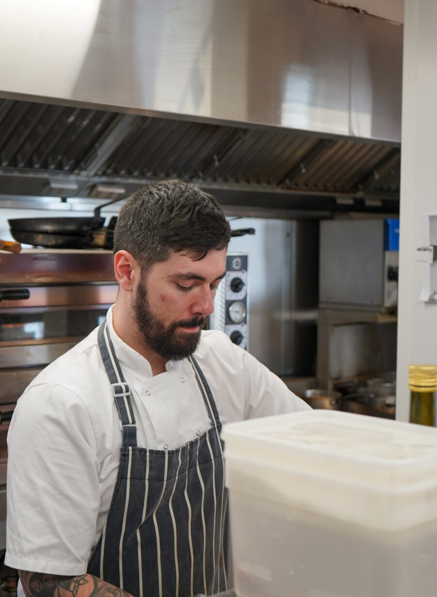 food being plated in restaurant kitchen