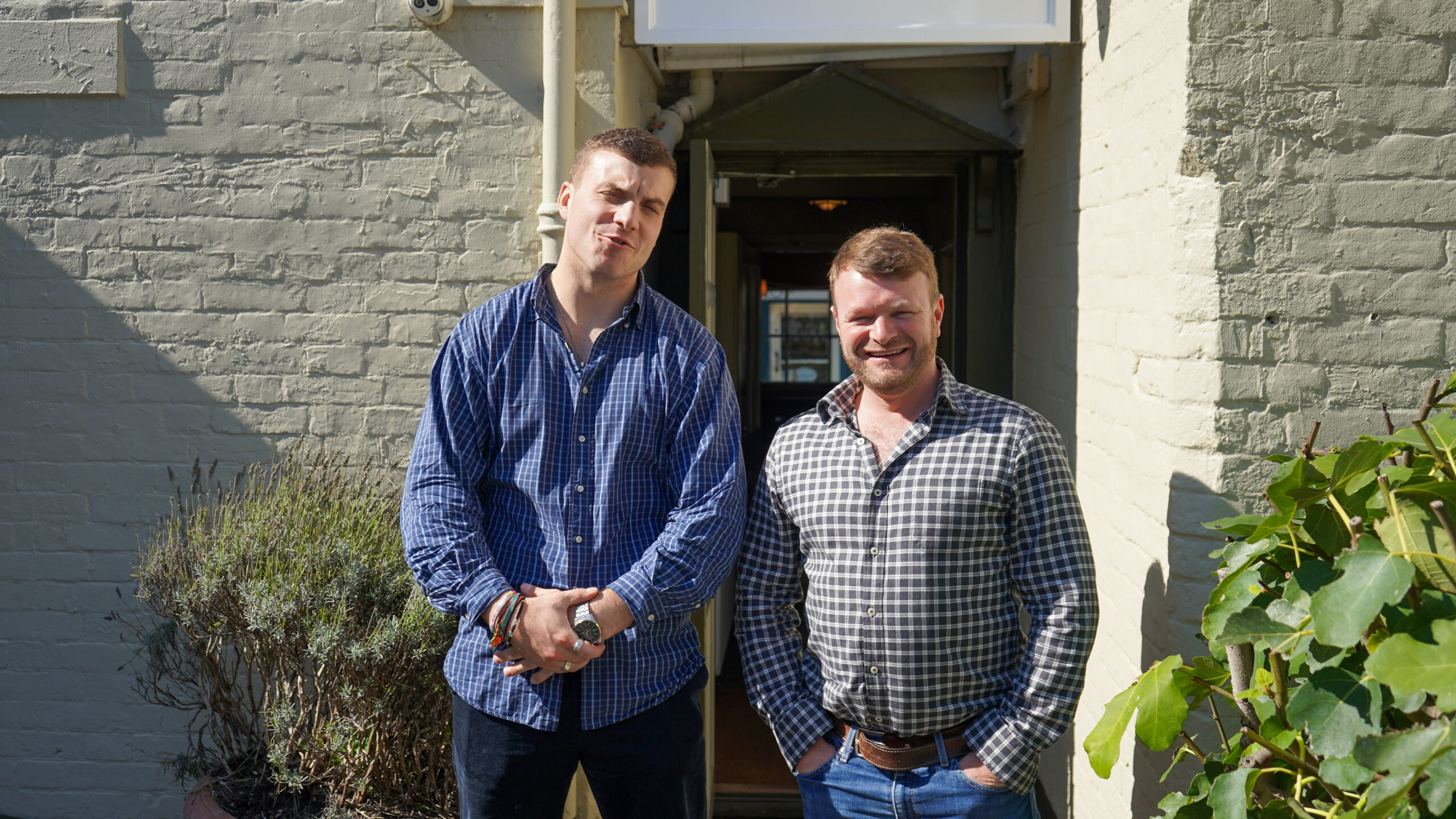 small team outside the pub entrance